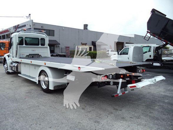 Kenworth T280 tow truck rear and side view, flatbed with hydraulic winch and ramps, white paint, stock number KW1STEPSIDEWHT visible in listing.