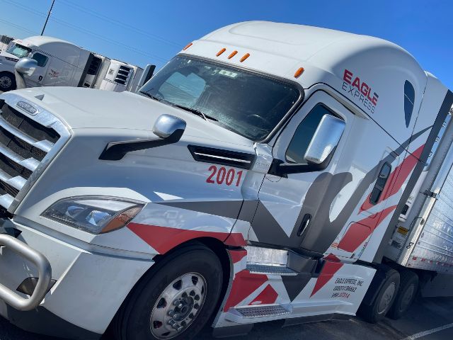 Semi truck showing side view with Freightliner Cascadia 2001 number and Eagle Express branding on cab.