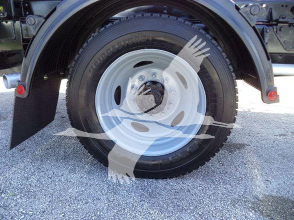 Ford F-550 truck wheel and tire showing steel rim and tire sidewall.