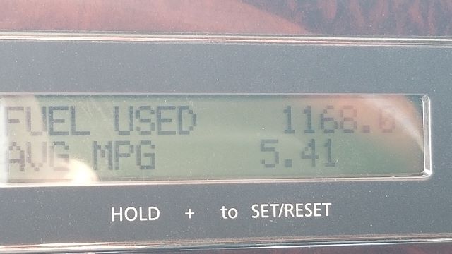 Truck gauge display showing 'FUEL USED' with value 1168.0 and 'AVG MPG' 5.41.