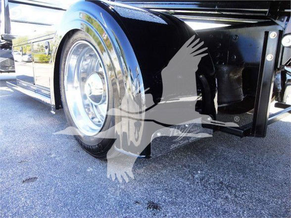 Front wheel and fender of a 2022 International MV truck showing chrome wheel, black painted frame and undercarriage components.