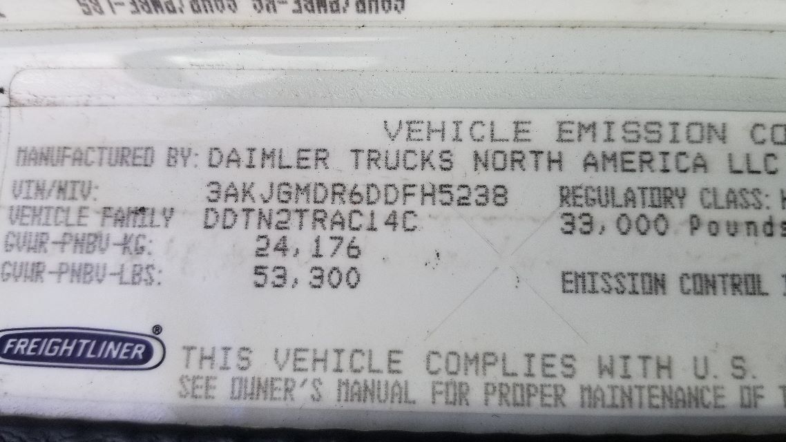Label on Freightliner Coronado truck showing VIN and engine/axle details. Text includes FREIGHTLINER logo, 2013 Freightliner Coronado information, VIN 3AKJGMDR6DDFH5238, stock NASCAR, and various specs such as engine and model codes.