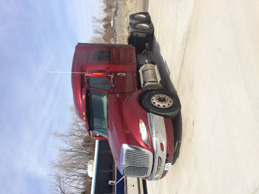2011 International Prostar conventional sleeper tractor with maroon color, grille, dual rear axles, and sleeper cab.