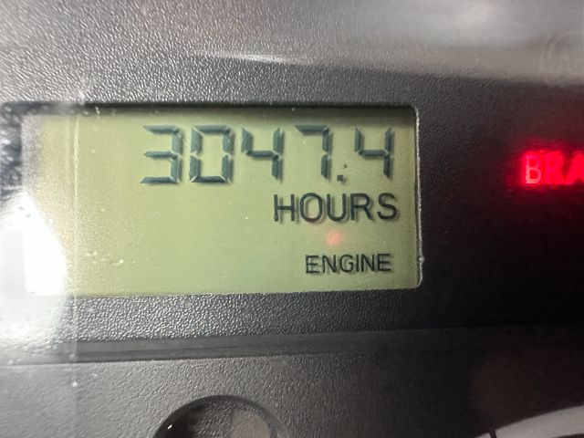 Dashboard gauge showing 3047.4 hours on the engine hour meter.