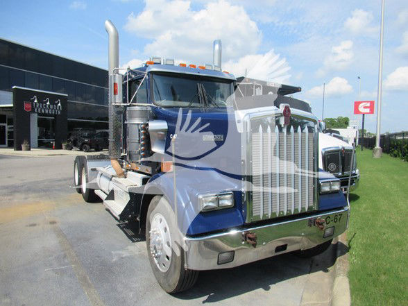 KENWORTH W900L conventional daycab truck in blue with chrome grille and exhaust stacks.