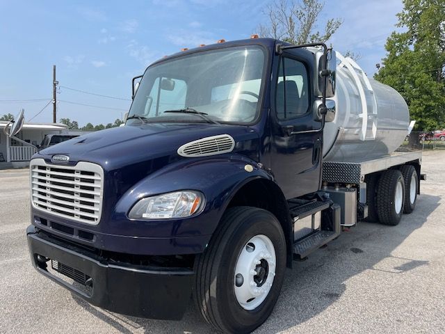 2013 Freightliner M2 sewer rodder septic truck with tank on back and heavy-duty rear wheels.
