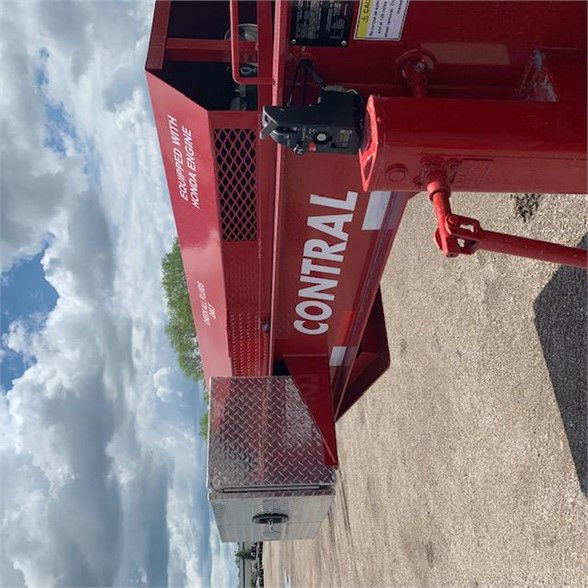Container delivery trailer side shows red structure with 'CONTAIN' lettering, alloy toolbox, hitch, and wedge-style hitch area. Side panel includes label text and a diamond plate toolbox.