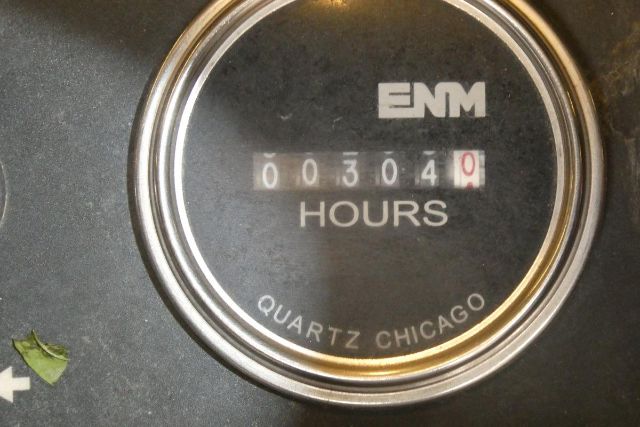Truck gauge showing 00304 hours and ENM branding, Quartz Chicago on the dial.