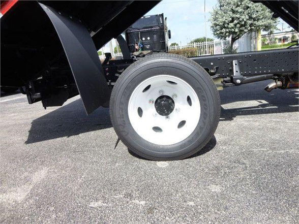 Isuzu NPR HD truck wheel and chassis components visible in a stock image.