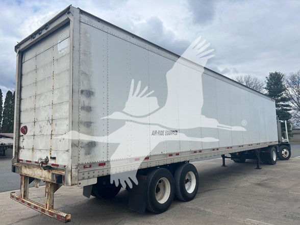 Great Dane sheet and post roll door trailer showing dual rear axles, grey exterior, with some wear. VIN tag and stock number not legible from image.