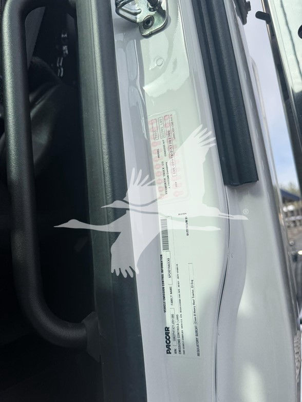 Kenworth T880 door jamb label area with VIN and specifications visible; PACCAR branding label and barcodes present.