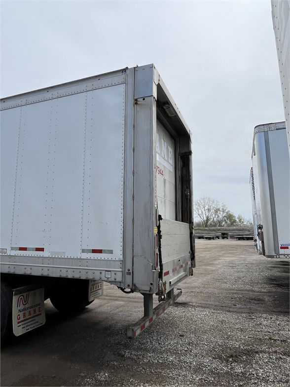 Great Dane 2015 dry van trailer with open rear ramp/dock area showing interior wall and door frame, parked in a lot.