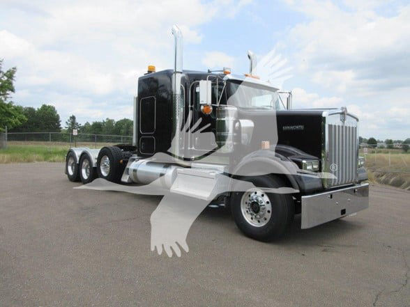 Kenworth W900B conventional sleeper truck in a parking lot showing chrome exhaust stacks, black cab and silver steps.