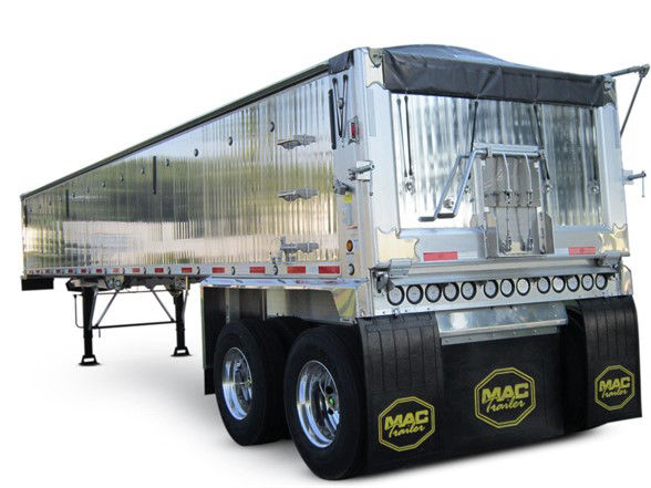 2023 dump trailer side and rear view with polished aluminum, MAC trailer mud flaps, dual rear axles.