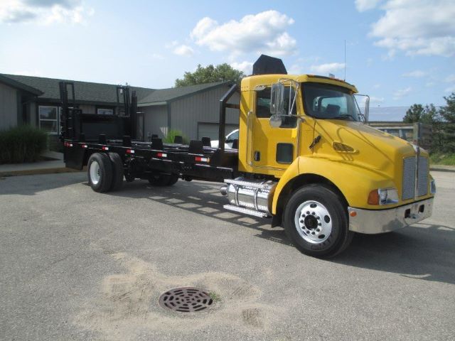 2007 Kenworth T300 flatbed truck in yellow with extended cab and chassis, VIN 2NKMHD7X87M205002, stock 205002.