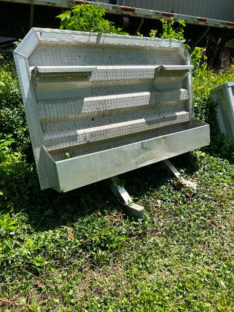 Galvanized aluminum headache rack component with diamond plate pattern and mounting brackets. Text not clearly visible.