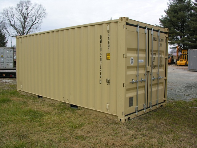 Container trailer with beige colored shipping container showing side and rear doors with tall vertical marks and various stenciled numbers and logos.