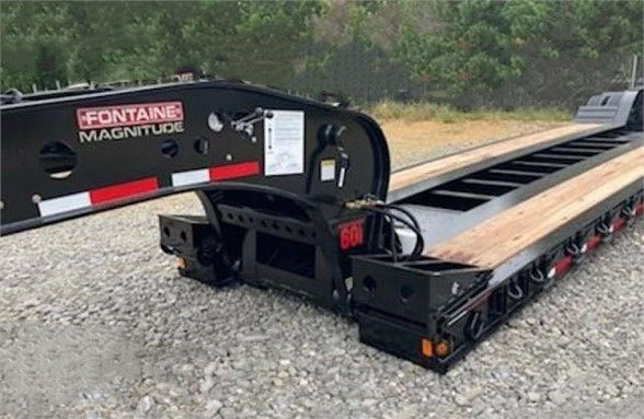 Fontaine Magnitude 60 MFLD lowboy trailer showing deck sections and frame with label text.