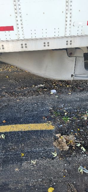 Trailing edge of a 2014 Wabash dry van trailer showing exterior wall with riveted panels and rear corner.