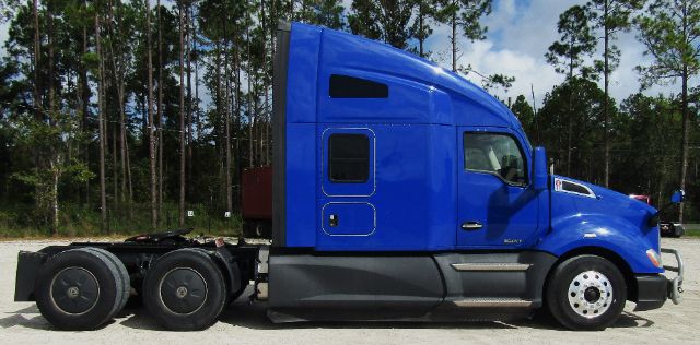 Kenworth T680 cab and chassis side view showing blue exterior and side fuel tank area.