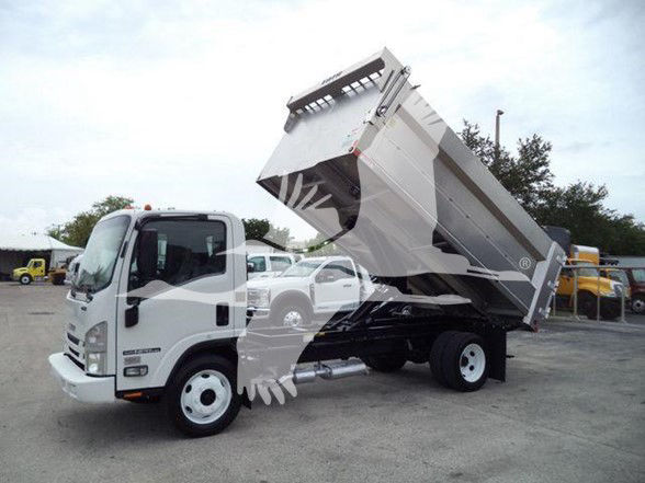 Isuzu NPR HD dump truck with bed raised, side view showing white cab and gray dump bed.