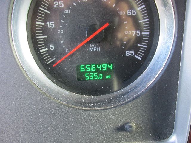 Truck gauge cluster showing speedometer with digital odometer reading 656494 and 395.0 mi.