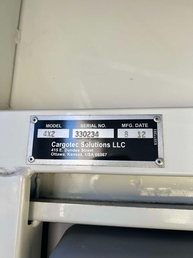 Identification plate on a 2012 Ottawa truck showing Model 4X2, Serial No. 330234, MFG Date 8 12, Cargotec Solutions LLC address.