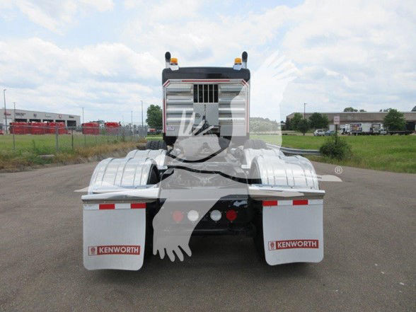 Kenworth W900B truck rear view showing fenders with Kenworth mud flaps and reflective reflectors.