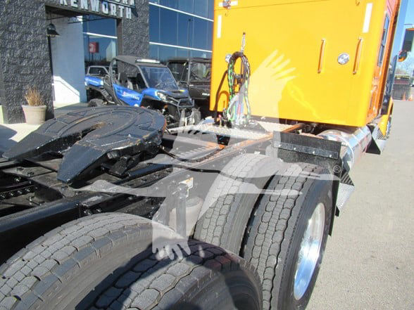 Kenworth W900L truck chassis with rear wheels and orange cab visible, stock SR183547 VIN 1XKWD49X3SR183547.