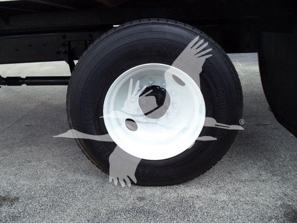 2019 International DURASTAR 4300 box truck wheel and tire showing white steel rim and black tire.