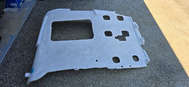 2022 Volvo 760 sleeper truck part panel showing large cutout and multiple mounting holes.