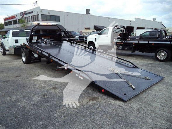 Ram 2024 Ram 5500 SLT tow truck with a flatbed.