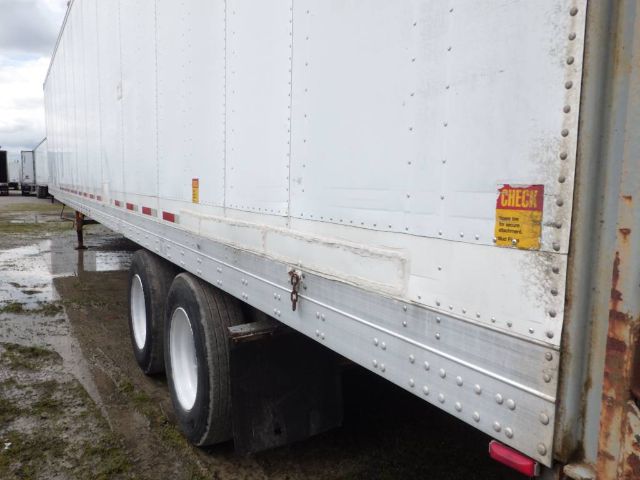 Fruehauf storage/short haul trailer side view showing tandem axles and rear clearance lights.