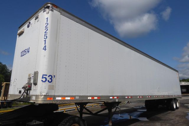 Great Dane trailer showing 53' length and white exterior with blue yardage markings and VIN/stock numbers on the back