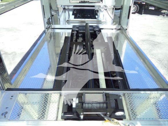 Kenworth T280 interior view showing truck bed with chrome framing and hydraulic components.