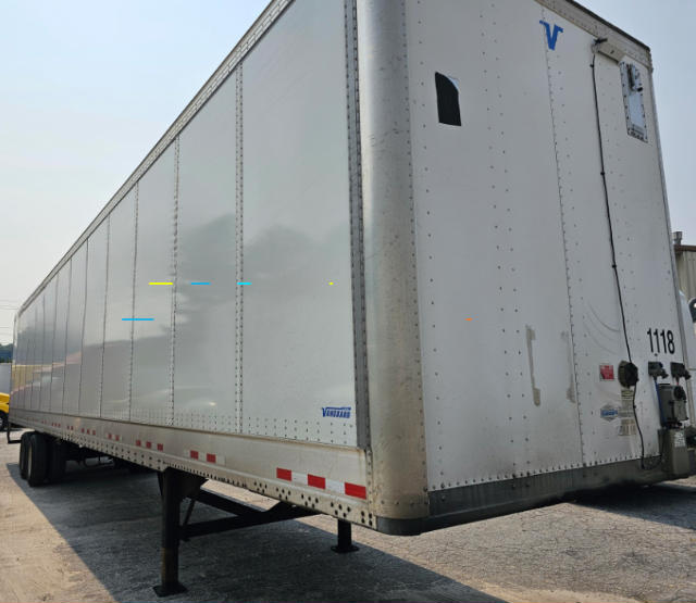  trailer showing Vanguard VXP utility trailer side and rear with landing legs and rear doors
