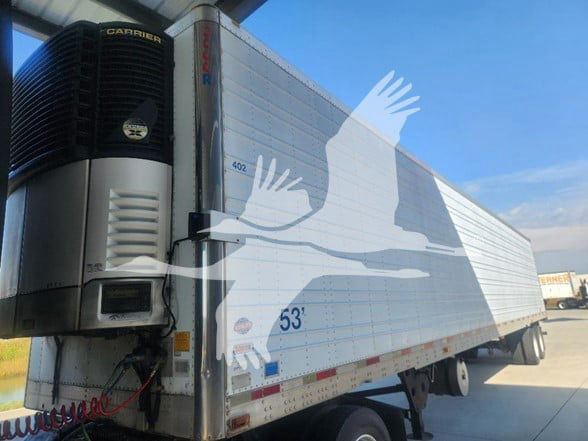 Utility trailer with Carrier refrigeration unit at front. Side shows 53' length and 402 stock number. VIN 1UYVS25356M764606 visible.