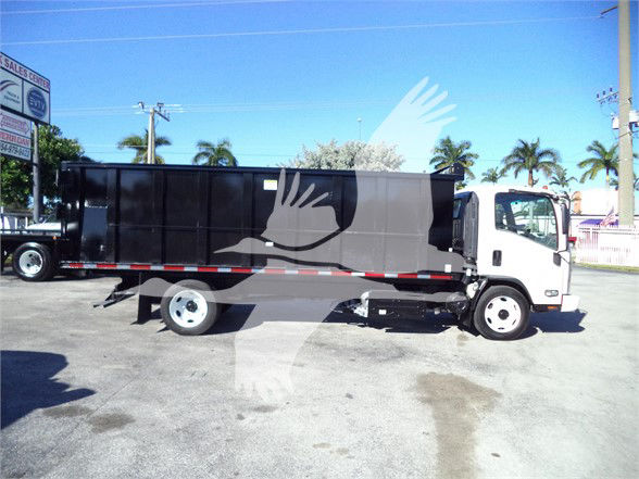 2017 Isuzu NRR dump truck side view with dump bed, white cab and black body, showing stock number 18FTDUMPNRRFM.