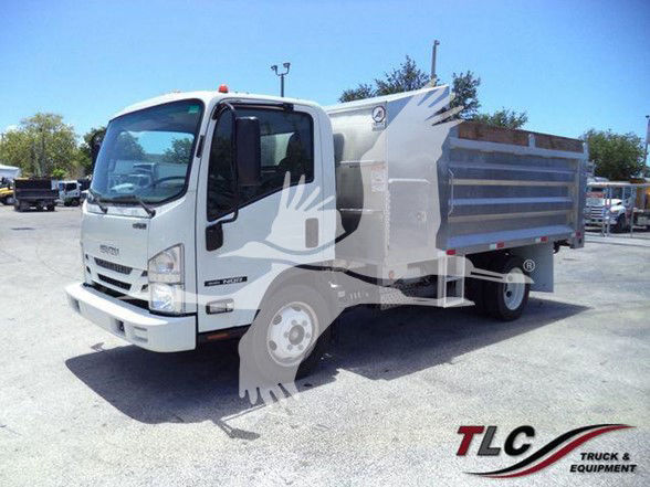 Isuzu NQR dump truck in service showing cargo bed and front cab with STL logo watermark