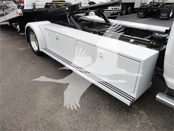 Ram 5500 HD SLT toolbox side with storage compartments, white exterior, under-bed area visible.
