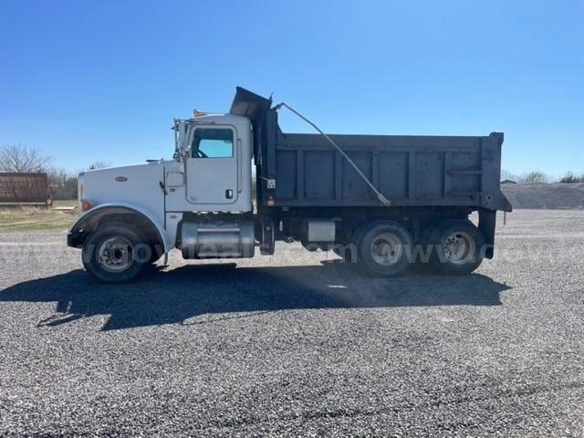 Peterbilt 365 dump truck side view showing cab, chassis, and dump bed with hydraulic mechanism.