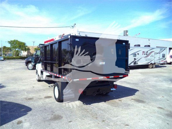 Dump truck bed on Ford E-450 utility/grapple-style dump body in black with white cab, rear view, stock number T57118 PB.