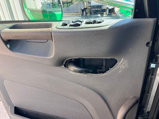 Panel interior of a 2016 Peterbilt 348 truck door with missing armrest panel, exposing internal components. No legible labels or fluid text visible.