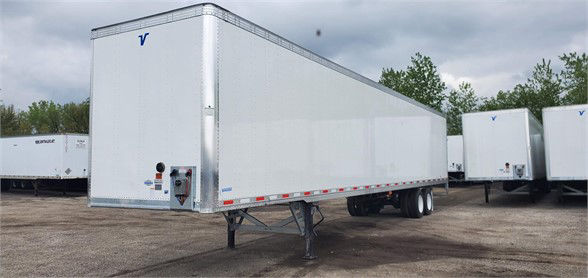 MAXCUBE dry van trailer showing front nose and side profile with stock number 406961 visible.