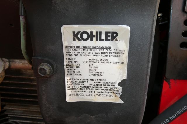 Kohler engine label on industrial equipment with text including engine information, model and serial details.