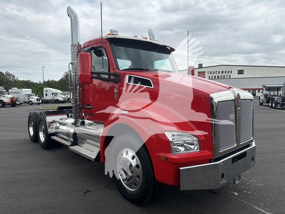 Kenworth T880 conventional daycab truck in red, front angled view showing chrome grille, exhaust stack, and dual rear axles.