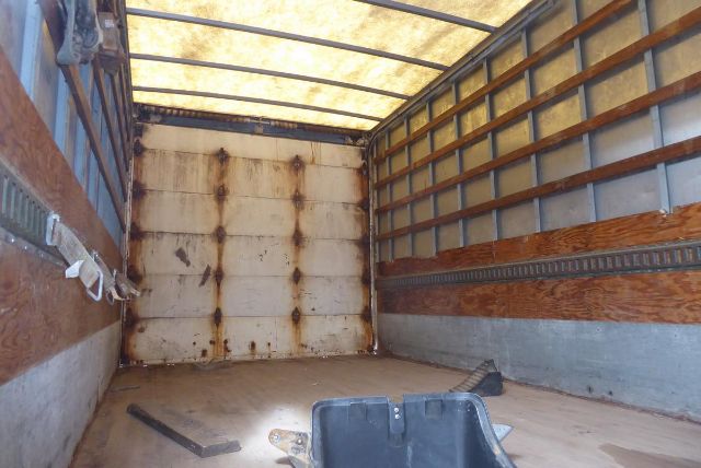 Freightliner M2 106 truck box interior showing cargo area and rear doors.