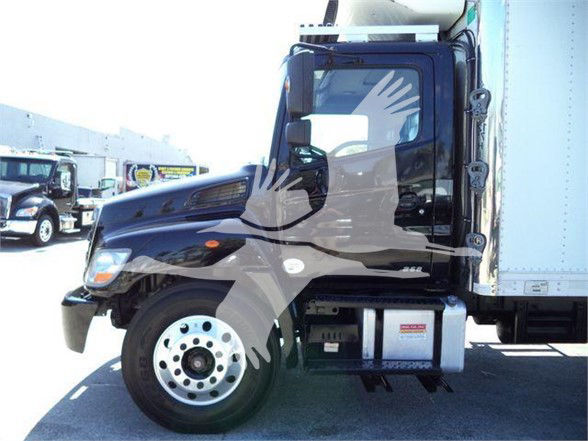 Truck cab and front wheel of a 2016 Reefer truck showing a side view. Visible text includes VIN-like and stock context laid over image? readable on the truck: none clearly legible; there is a logo on door and a small plate under cab.