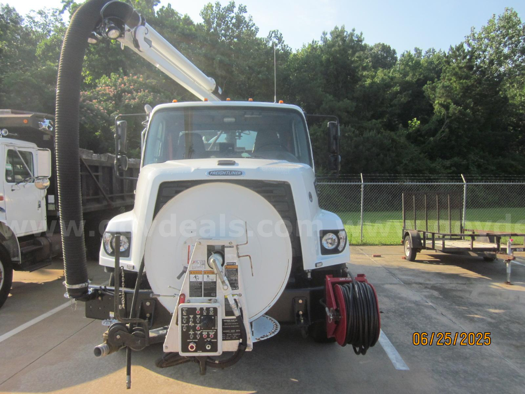 Freightliner vacuum truck rear view showing hose reel and control panel with cab and front bumper, date stamp 06/25/2025.