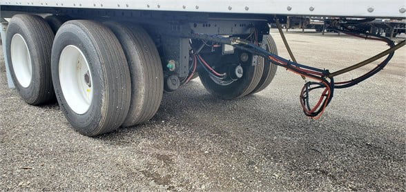Vanguard VXP dry van trailer undercarriage showing tandem axles and wiring near the hitch.